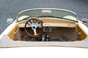 closeup Detail of vintage Cabriolet convertible interior, retro sport car cabrio parked on street, part of Oldtimer car collection, trunk lid, evoking sense of nostalgia and automotive history