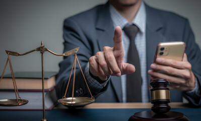 Lawyer's hand concept Justice with Judge gavel, Businessman in suit or Hiring lawyers in the digital system. Legal law, prosecution, legal adviser, lawsuit, detective, investigation,legal consultant.