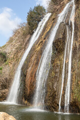 Ayun  waterfall flows from a crevice in the mountain and is located in the continuation of the rapid, shallow, cold mountain Ayun river, in the Galilee, near Metula city, in northern Israel