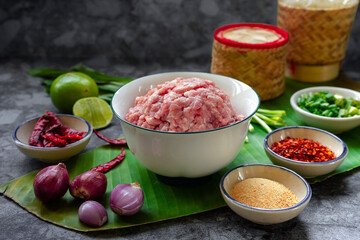 minced pork and ingredients of pork larb (Thai food)