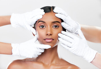 Woman, plastic surgery and hands in studio portrait with beauty, skincare and face with process by...