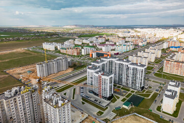Cityscape of a residential area with modern apartment buildings, new green urban landscape in the city. Modern architectural building of the city. Mortgage.