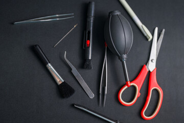 Set of hand tool on table with black mat.