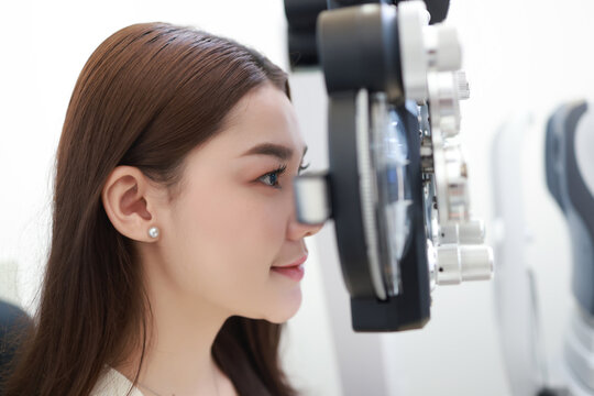 Close-up Beautiful patient's vision gets visual acuity test at Ophthalmology clinic.