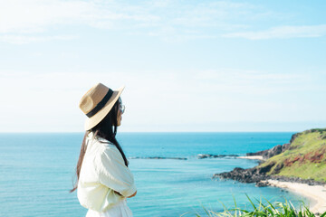 Fototapeta na wymiar image of a girl and a clear blue beach