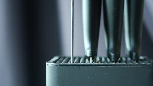 Set of kitchen knives in a box .
