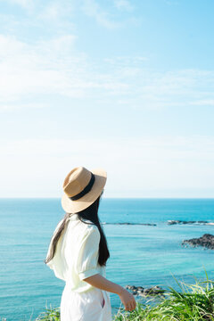 image of a girl and a clear blue beach