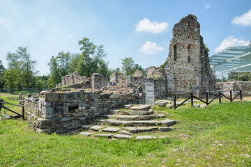 Ruins of a fortified settlement. Castelseprio, Italy and the remains of the Basilica San Giovanni at the monumental Longobard complex in the archaeology park of Castelseprio, UNESCO Site - obrazy, fototapety, plakaty