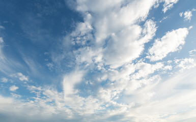 Cloudscape with white clouds and blue sky