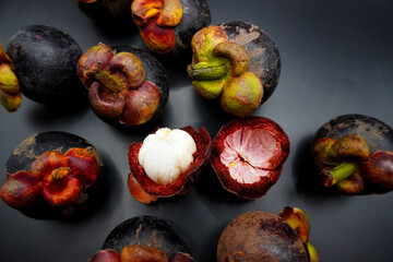 Mangosteen, Mangosteen group on black background, white meat