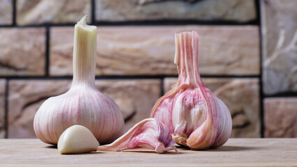 two heads of fresh young garlic