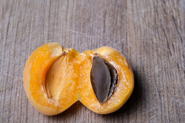 juicy pulp and apricot pit