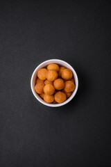 Delicious fried potato balls with breaded mozzarella, salt, spices and herbs