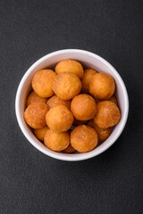 Delicious fried potato balls with breaded mozzarella, salt, spices and herbs