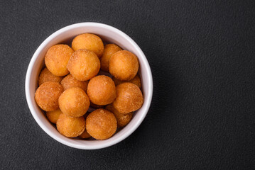 Delicious fried potato balls with breaded mozzarella, salt, spices and herbs