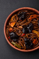 Delicious fresh buckwheat noodles or udon with mushrooms, peppers and other vegetables