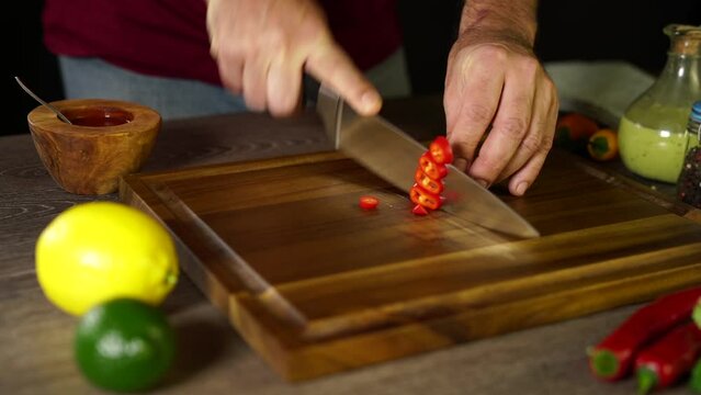 Cutting Red Jalapeno on the board