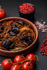 Delicious fresh buckwheat noodles or udon with mushrooms, peppers and other vegetables