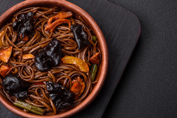 Delicious fresh buckwheat noodles or udon with mushrooms, peppers and other vegetables
