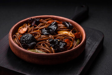 Delicious fresh buckwheat noodles or udon with mushrooms, peppers and other vegetables