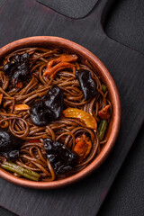 Delicious fresh buckwheat noodles or udon with mushrooms, peppers and other vegetables