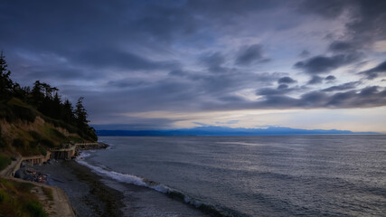 Overcast sky along Pacific coast in Washington state during dusk.