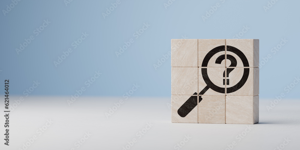 Wall mural question mark symbol on wooden cubes on blue background. question mark under magnifying glass. probl