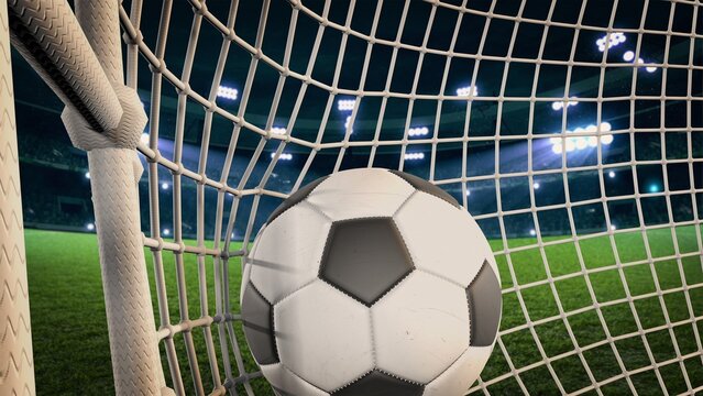 Football Stadium. A soccer ball flies into the net. The ball enters the goal and scores a goal.  The video of this image is in my portfolio.	