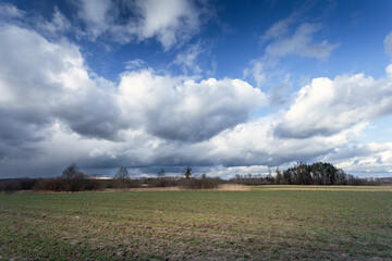 Fototapeta na wymiar Cloudy sky over farmland, eastern Poland
