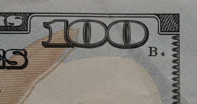 American one hundred dollar paper banknote in close up macro. Hundred Dollar Closeup. Stop Motion of 100 USD Bills. Concept Finance Business Investment Success. Rich business economy of usa.