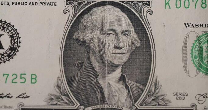 US President Washington on United States. American one dollar paper banknote in close up macro. One USD cash macro view. 1 Dollar Cash Stop Motion. 1 Dollar Closeup. Stop Motion of 1 USD Bills.