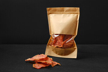 Spicy jerky pork meat in paper package