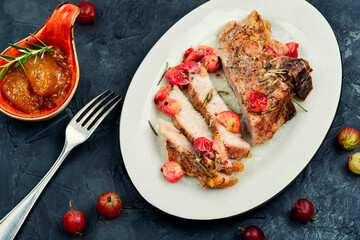 Beef steak with berry sauce.