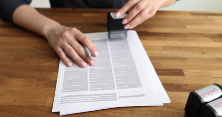 Seo woman puts stamp with text approved on contract. Businesswoman works with credit papers and signs document
