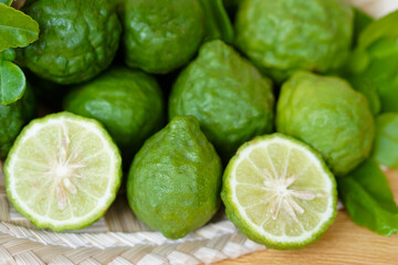 Bergamot fruits and leaves on  green  background. Concept, herbal fruits with sour taste, can be cooked as food seasoning and use for spa , aroma. Medicinal herb.                    