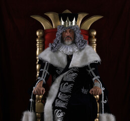 portrait of an old king on the throne