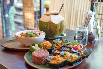 Indonesian food - satay, nasi campur, coconut, smoothie bowl   
