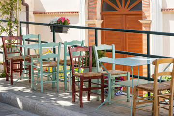 chairs and tables in outdoor area of bistro, restaurant