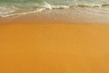Fototapeta na wymiar beach with golden sand and blue ocean water on most popular unawatuna