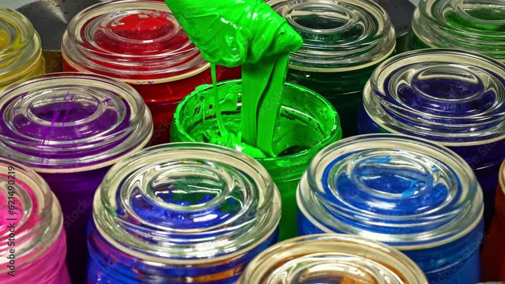 Aufkleber stirring green color.use a trowel to stir the mass in a clear glass bottle..the subtle hues swirled 