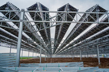 Large electrical power plant with many rows of solar photovoltaic panels