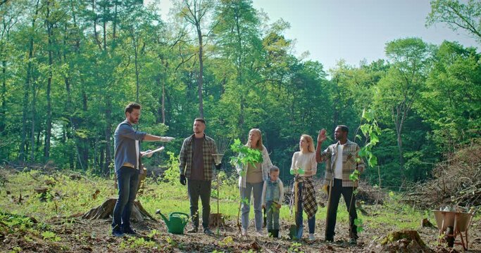 Group of young and diverse people having conversation to prepare for environmental restoration. Multicultural team of volunteers divides tasks to restore state of environment.
