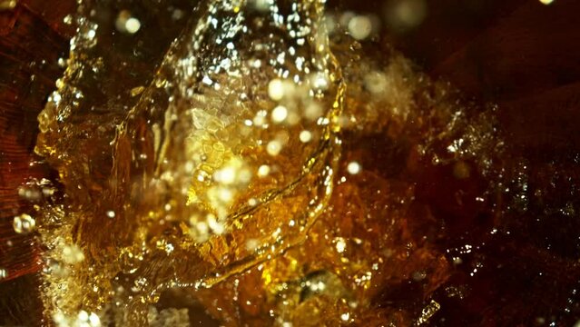 Super Slow Motion of Pouring Whiskey, Rum or Cognac Inside the Barrel. Filmed on High Speed Cinema Camera, 1000fps. Ultimate Composition View Inside the Wooden Keg.