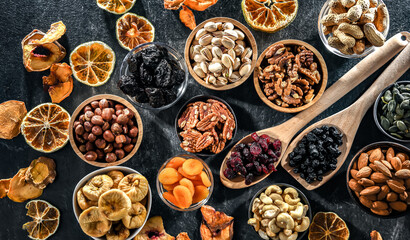 Composition with a variety of dried fruits and assorted nuts.