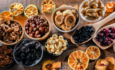 Composition with a variety of dried fruits and assorted nuts.