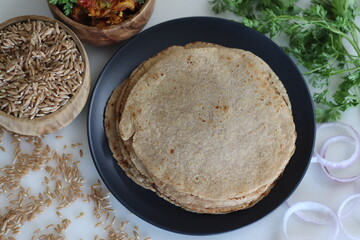 Khapli wheat roti served with baingan bharta.
