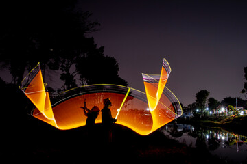 Silhouette of light painting at night