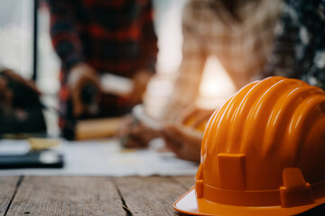 Engineer teams meeting working together wear worker helmets hardhat on construction site in modern...