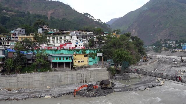 A Picturesque Village Nestled in the Mountain's Embrace Along the Riverside