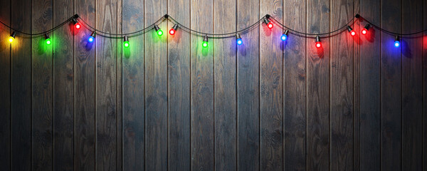 Garland of colored light bulbs on a wooden background, space for your task or message. 3d render.